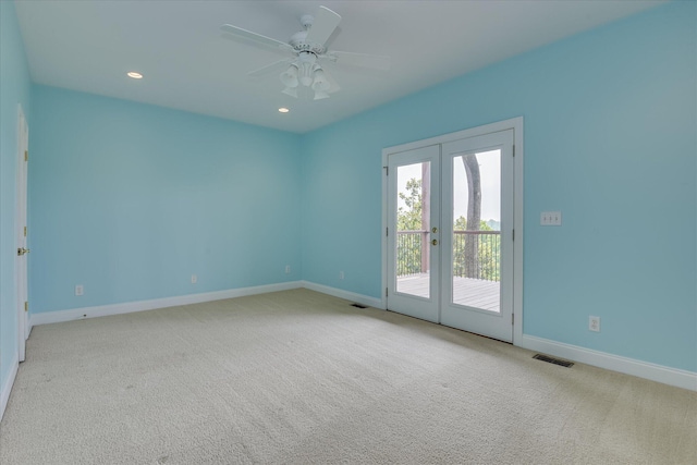 empty room with french doors, baseboards, carpet, and recessed lighting
