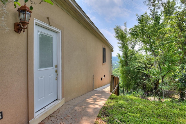 view of side of home featuring stucco siding