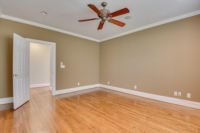 spare room with ceiling fan, light wood finished floors, baseboards, crown molding, and recessed lighting