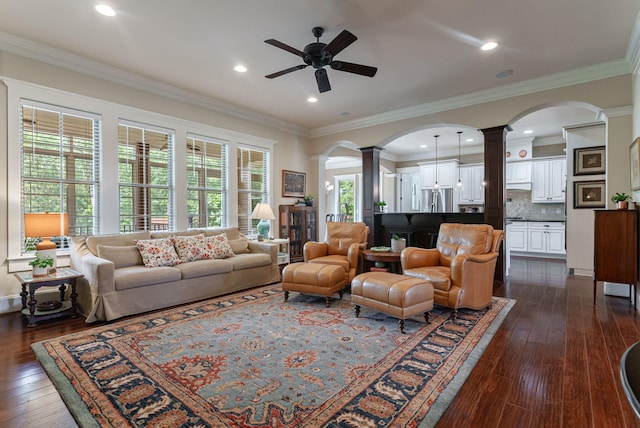 3820 Blue Springs Trce, Evans, GA 30809 - living area featuring decorative columns, arched walkways, a ceiling fan, dark wood finished floors, and crown molding