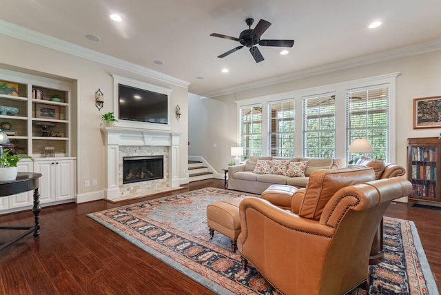 3820 Blue Springs Trce, Evans, GA 30809 - living room with dark wood-style flooring, ornamental molding, ceiling fan, a glass covered fireplace, and baseboards