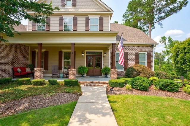 3820 Blue Springs Trce, Evans, GA 30809 - view of front of property featuring a porch, brick siding, a front yard, and roof with shingles