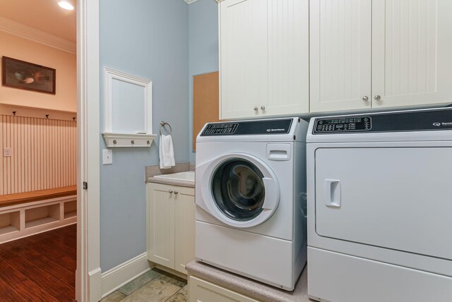 3820 Blue Springs Trce, Evans, GA 30809 - laundry area featuring ornamental molding, separate washer and dryer, cabinet space, and baseboards