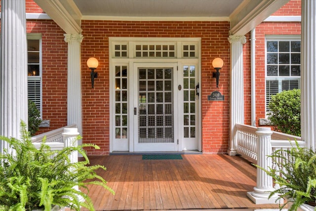 doorway to property featuring covered porch