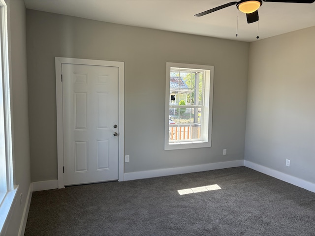 carpeted empty room featuring ceiling fan