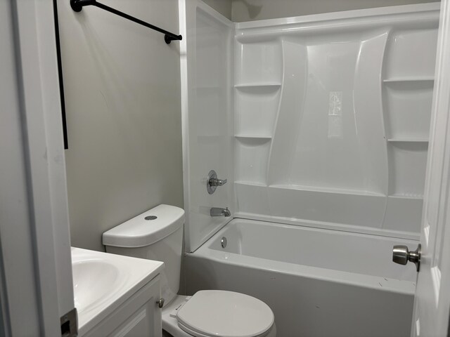 full bathroom with bathing tub / shower combination, vanity, and toilet