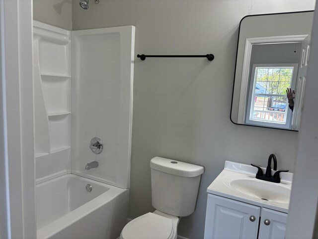 full bathroom with vanity, toilet, and  shower combination