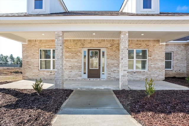 entrance to property featuring a porch