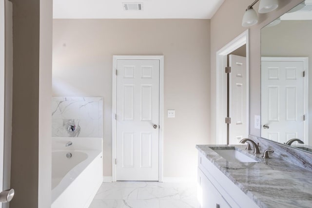 bathroom with a bath and vanity