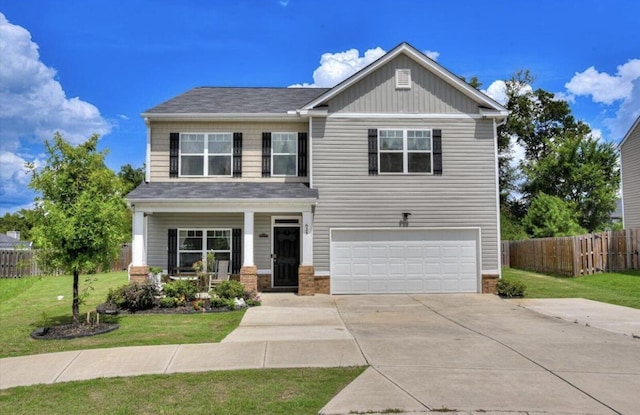 craftsman-style house with a porch, an attached garage, fence, concrete driveway, and a front yard