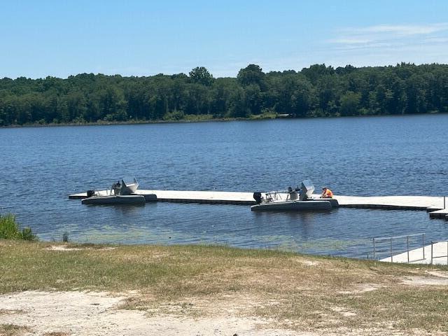 view of dock with a water view