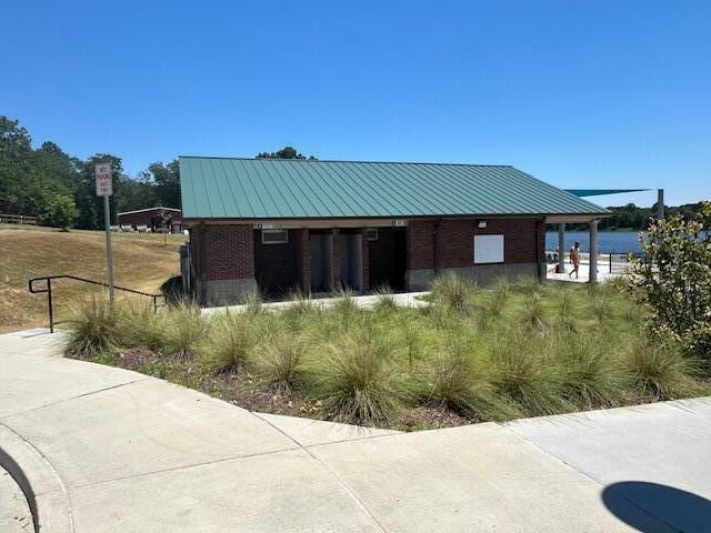 view of outbuilding with a water view