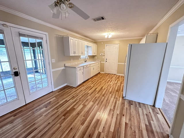 2102 Howard Mill Rd, North Augusta, SC 29841 - kitchen with white appliances, light wood-style flooring, crown molding, light countertops, and a ceiling fan