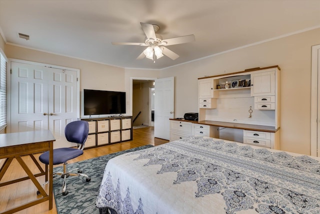 711 Augusta St, Mccormick, SC 29835 - bedroom featuring wood finished floors, a desk, crown molding, ceiling fan, and a closet