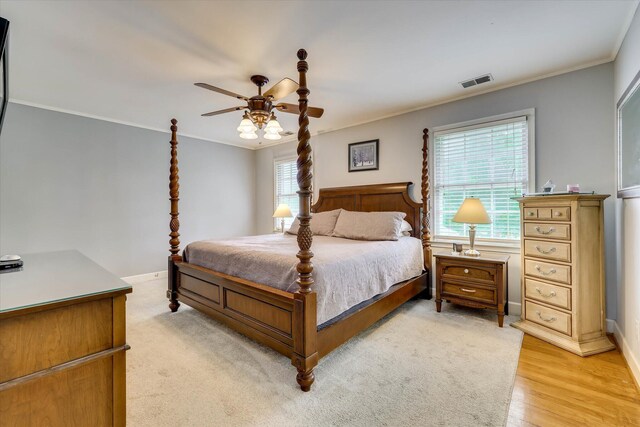 711 Augusta St, Mccormick, SC 29835 - bedroom featuring crown molding, baseboards, a ceiling fan, and light wood finished floors