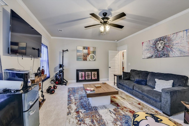 living room featuring ceiling fan, carpet floors, ornamental molding, and visible vents