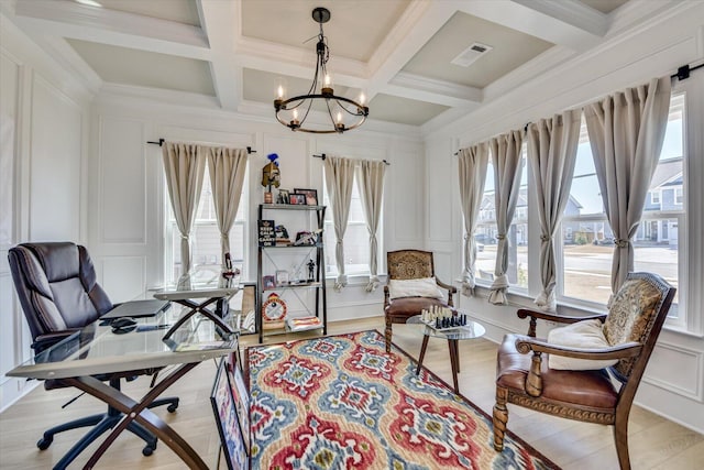 sitting room with beam ceiling, visible vents, a decorative wall, and a notable chandelier