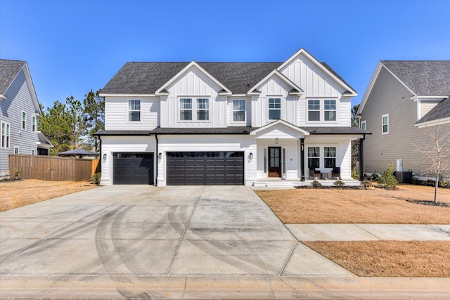 modern inspired farmhouse featuring a garage, fence, board and batten siding, and concrete driveway