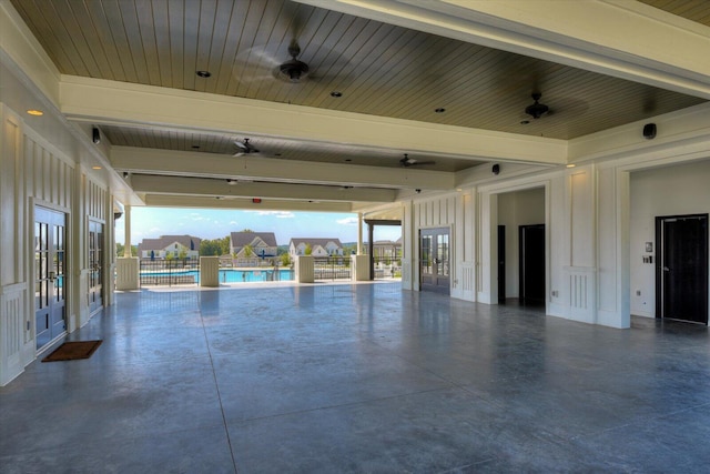 interior space featuring ceiling fan, a community pool, and french doors