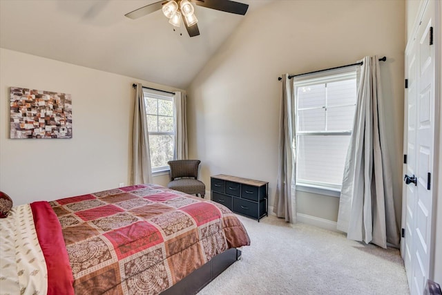 bedroom featuring lofted ceiling, ceiling fan, baseboards, and light colored carpet