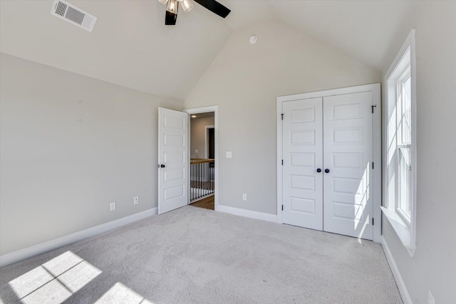 unfurnished bedroom featuring baseboards, carpet, visible vents, and a closet