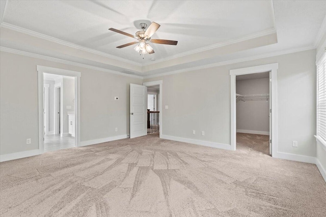 2318 Laurens St, Grovetown, GA 30813 - unfurnished bedroom with crown molding, carpet floors, a raised ceiling, and a spacious closet
