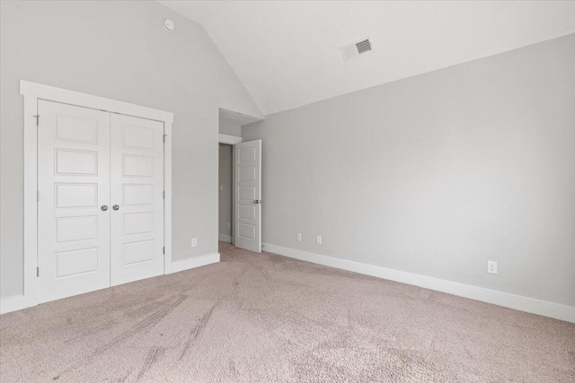 2318 Laurens St, Grovetown, GA 30813 - unfurnished bedroom with carpet flooring, lofted ceiling, a closet, and baseboards