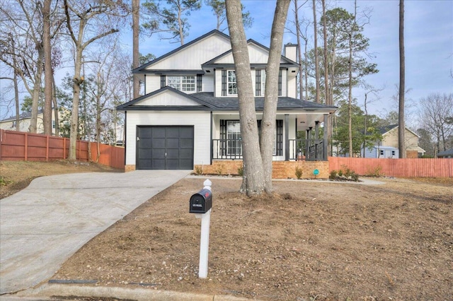 view of front of home featuring a garage and covered porch