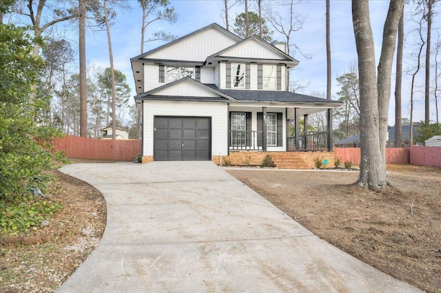 view of front facade with a porch and a garage