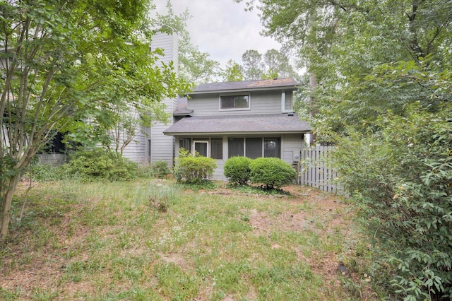 20 Teal Ct, North Augusta, SC 29841 - back of house featuring fence, a chimney, a sunroom, and roof with shingles