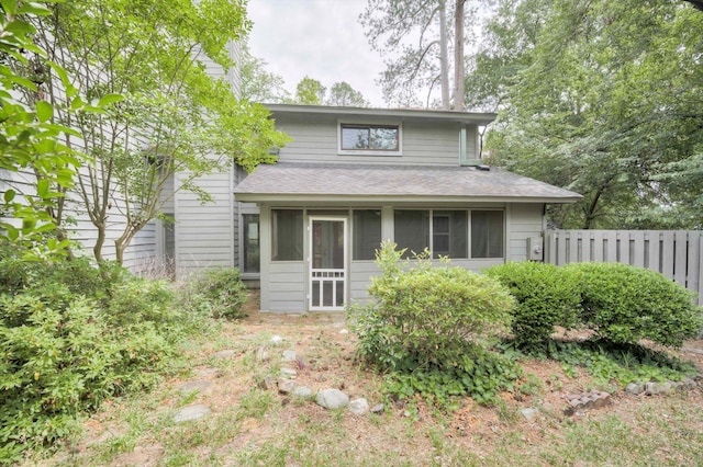 20 Teal Ct, North Augusta, SC 29841 - back of property with a sunroom, roof with shingles, and fence