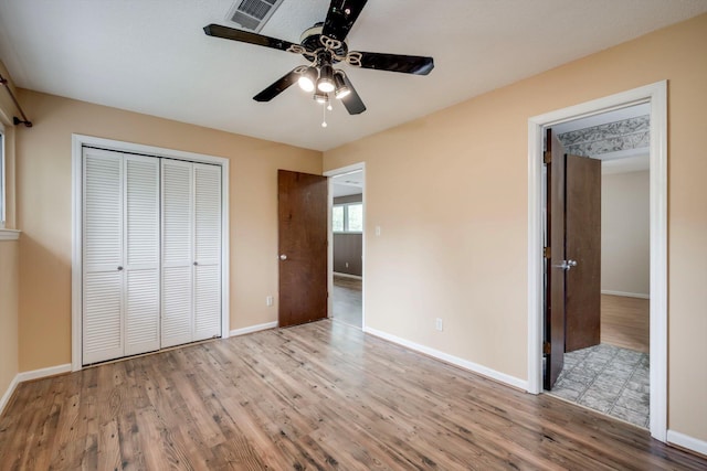 20 Teal Ct, North Augusta, SC 29841 - unfurnished bedroom featuring visible vents, baseboards, wood finished floors, and a closet