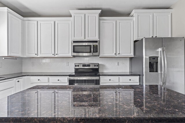4938 Coal Creek Dr, Graniteville, SC 29829 - kitchen with appliances with stainless steel finishes, white cabinetry, and decorative backsplash