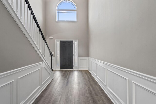4938 Coal Creek Dr, Graniteville, SC 29829 - entrance foyer featuring a decorative wall, stairs, a high ceiling, dark wood-type flooring, and a wainscoted wall