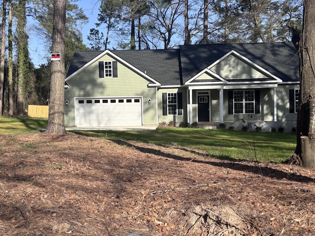 view of front of home featuring covered porch, a front lawn, a garage, and dirt driveway