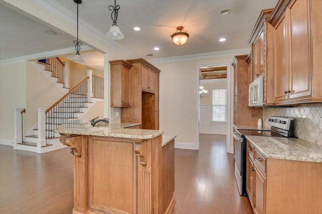 kitchen with light stone counters, crown molding, hanging light fixtures, and stainless steel range with electric stovetop