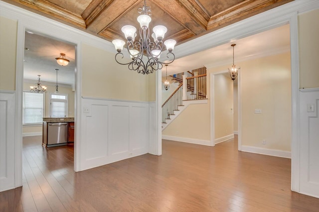 interior space featuring beam ceiling, ornamental molding, and coffered ceiling