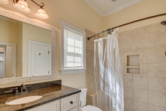 bathroom featuring a shower with shower curtain, vanity, toilet, and crown molding