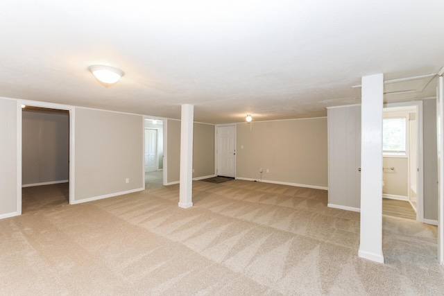 basement featuring light colored carpet