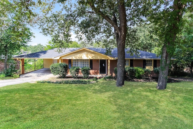 ranch-style house featuring a front lawn and a carport