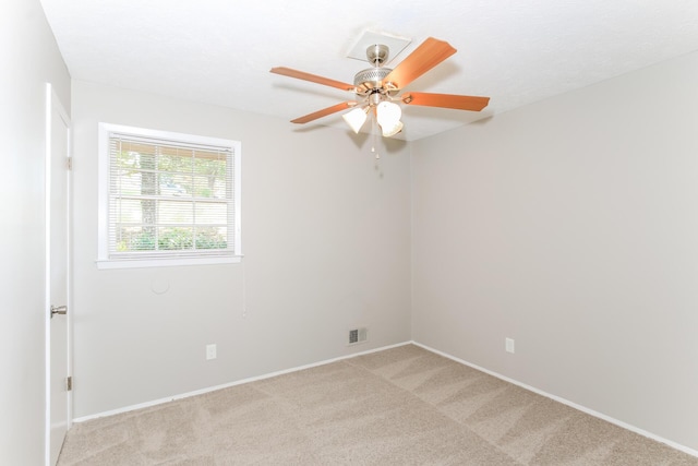 empty room with light carpet and ceiling fan