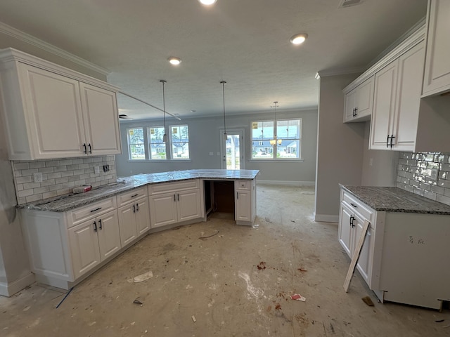 28 Coslett Dr, North Augusta, SC 29860 - kitchen featuring ornamental molding, a peninsula, tasteful backsplash, white cabinets, and light stone counters