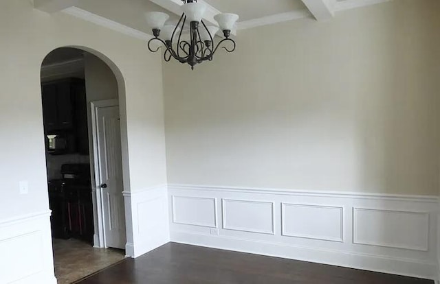 1139 Prides Xing, Aiken, SC 29801 - unfurnished dining area featuring arched walkways, a decorative wall, wainscoting, a chandelier, and dark wood-style floors