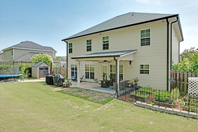 945 Watermark Dr, Evans, GA 30809 - back of house featuring a shed, a patio area, a ceiling fan, a trampoline, and an outdoor structure