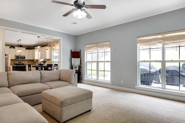 945 Watermark Dr, Evans, GA 30809 - living room featuring light carpet, baseboards, ceiling fan, and crown molding