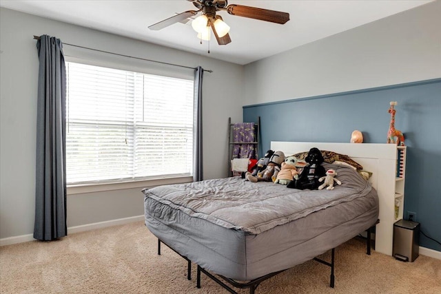 945 Watermark Dr, Evans, GA 30809 - carpeted bedroom with multiple windows, baseboards, and ceiling fan