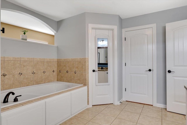 945 Watermark Dr, Evans, GA 30809 - bathroom featuring a bath and tile patterned floors