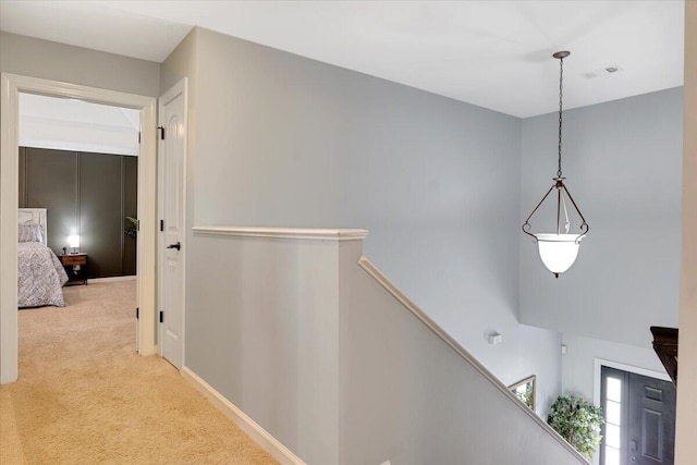 945 Watermark Dr, Evans, GA 30809 - hallway with light carpet, an upstairs landing, and baseboards