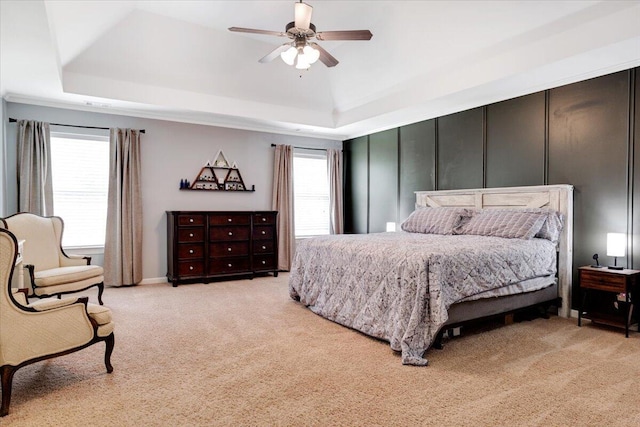 945 Watermark Dr, Evans, GA 30809 - bedroom featuring light colored carpet, multiple windows, and a raised ceiling