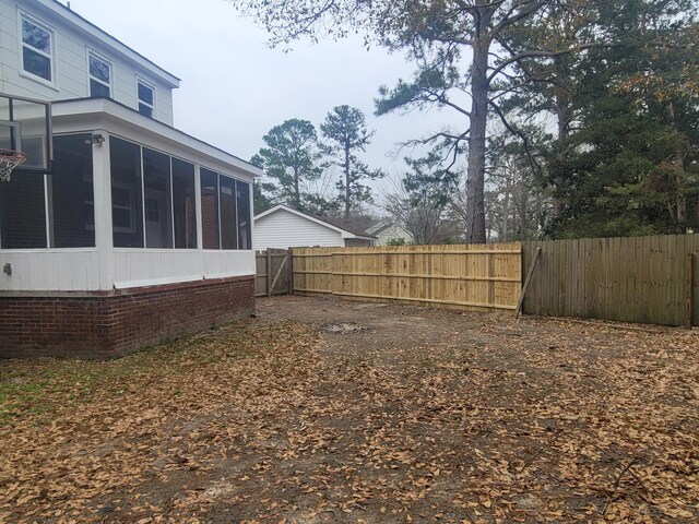 view of yard featuring a sunroom